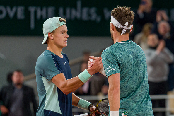 Holger Rune and Casper Ruud meet at the net after their quarterfinal match (Andy Cheung/Getty Images)