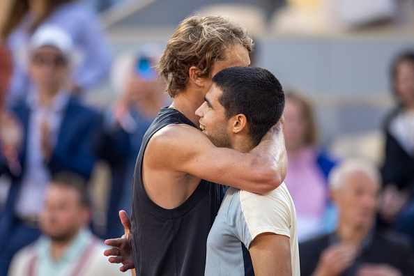 Zverev and Alcaraz share an embrace at the net after their quarterfinal match (Tim Corbis/Getty Images)