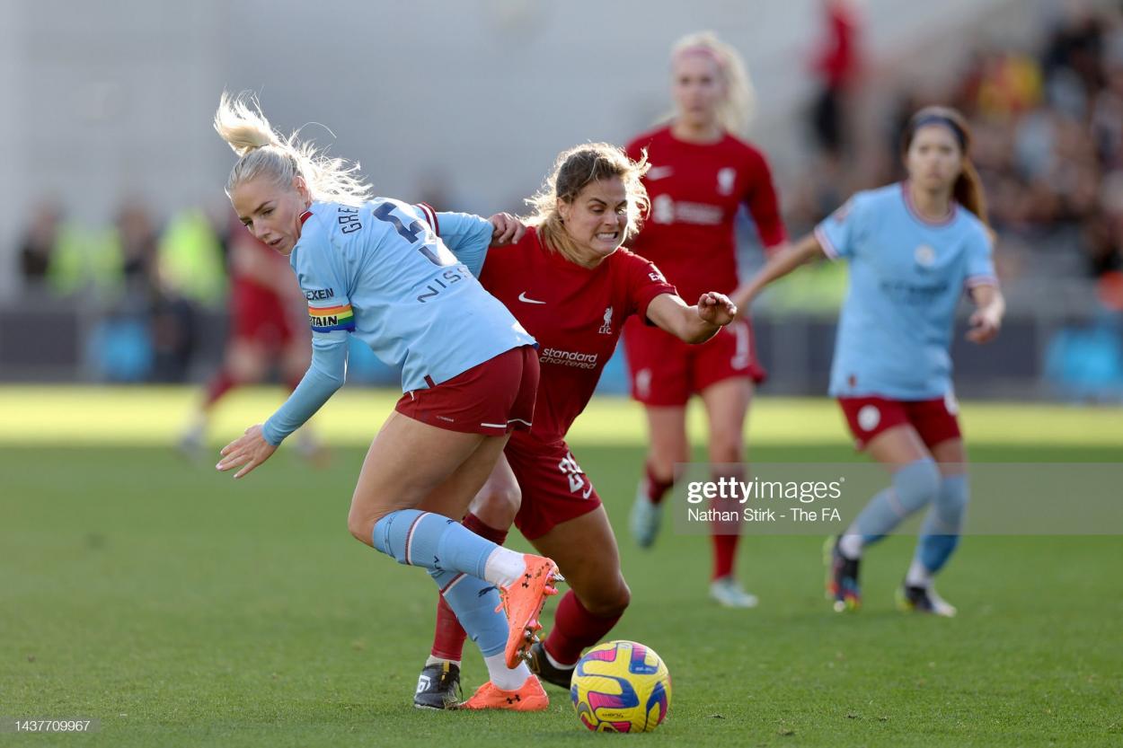 Katherine Stengel of Liverpool wins the ball from Alex Greenwood of Manchester City during the FA Women's Super League match between Manchester City and Liverpool at The Academy Stadium on October 30, 2022 in Manchester, England. (Photo by Nathan Stirk - The FA/The FA via Getty Images)