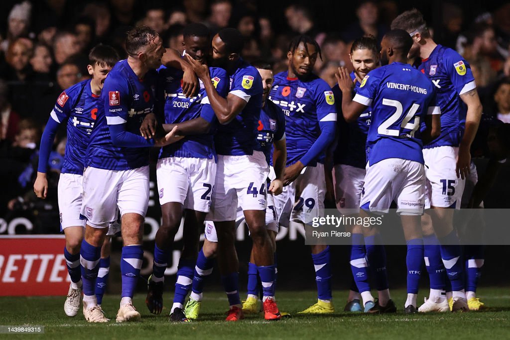 SANDHURST, ENGLAND - NOVEMBER 07: Panutche Camara of Ipswich Town celebrates scoring their team's third goal with teammates during the FA Cup First Round match between Bracknell Town and Ipswich Town at Bottom Meadow on November 07, 2022 in Sandhurst, England. (Photo by Ryan Pierse/Getty Images)
