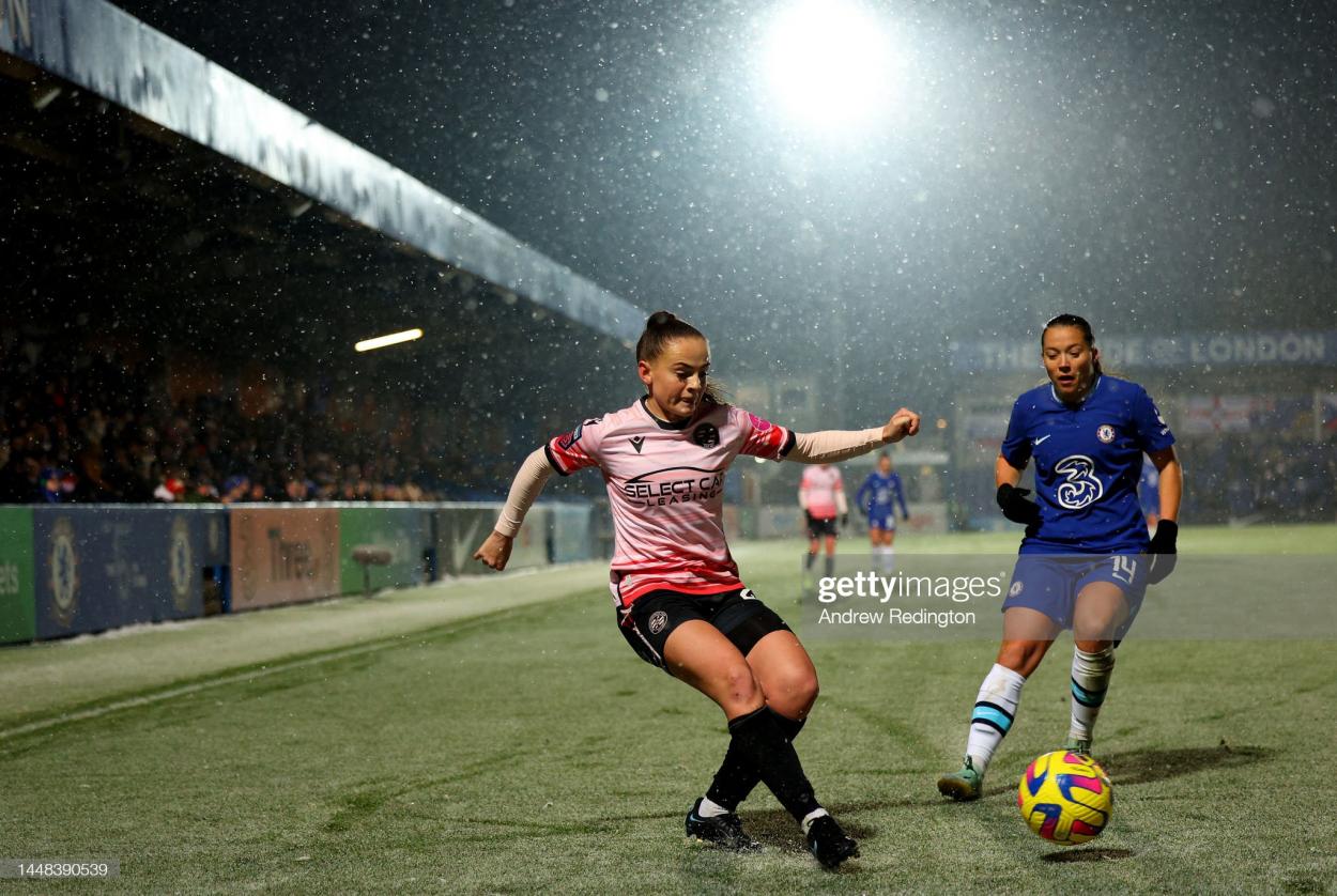 KINGSTON UPON THAMES, ENGLAND - DECEMBER 11: Lily Woodham of Reading passes the ball under pressure from Fran Kirby of Chelsea during the FA Women's Super League match between Chelsea and Reading at Kingsmeadow on December 11, 2022 in Kingston upon Thames, England. (Photo by Andrew Redington/Getty Images)