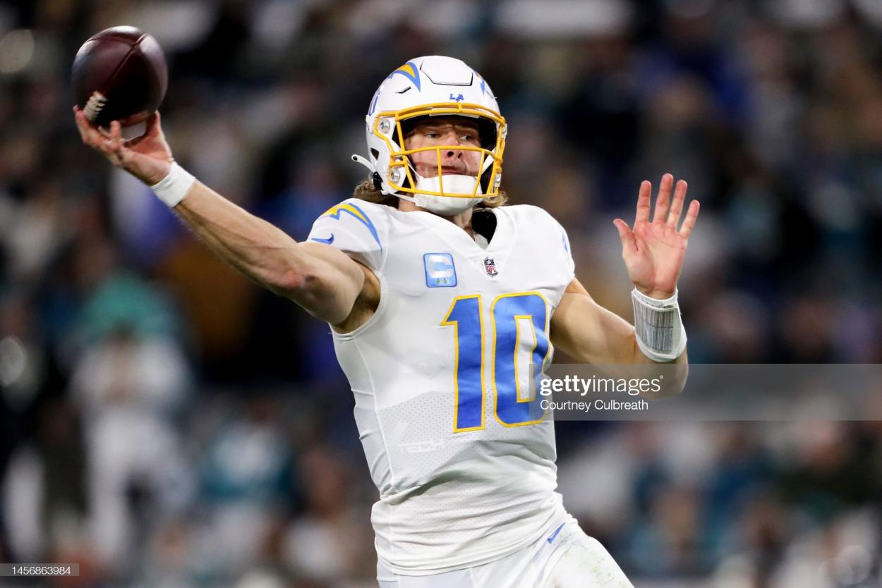 Justin Herbert #10 of the Los Angeles Chargers throws a pass against the <strong><a  data-cke-saved-href='https://www.vavel.com/en-us/nfl/2021/01/15/1055207-jacksonville-jaguars-appoint-urban-meyer-as-new-head-coach.html' href='https://www.vavel.com/en-us/nfl/2021/01/15/1055207-jacksonville-jaguars-appoint-urban-meyer-as-new-head-coach.html'>Jacksonville Jaguars</a></strong> during the first half of the game in the AFC Wild Card playoff game at TIAA Bank Field on January 14, 2023 in Jacksonville, Florida. (Photo by Courtney Culbreath/Getty Images) AFC Wild Card Playoffs - Los Angeles Chargers v Jacksonville Jaguars