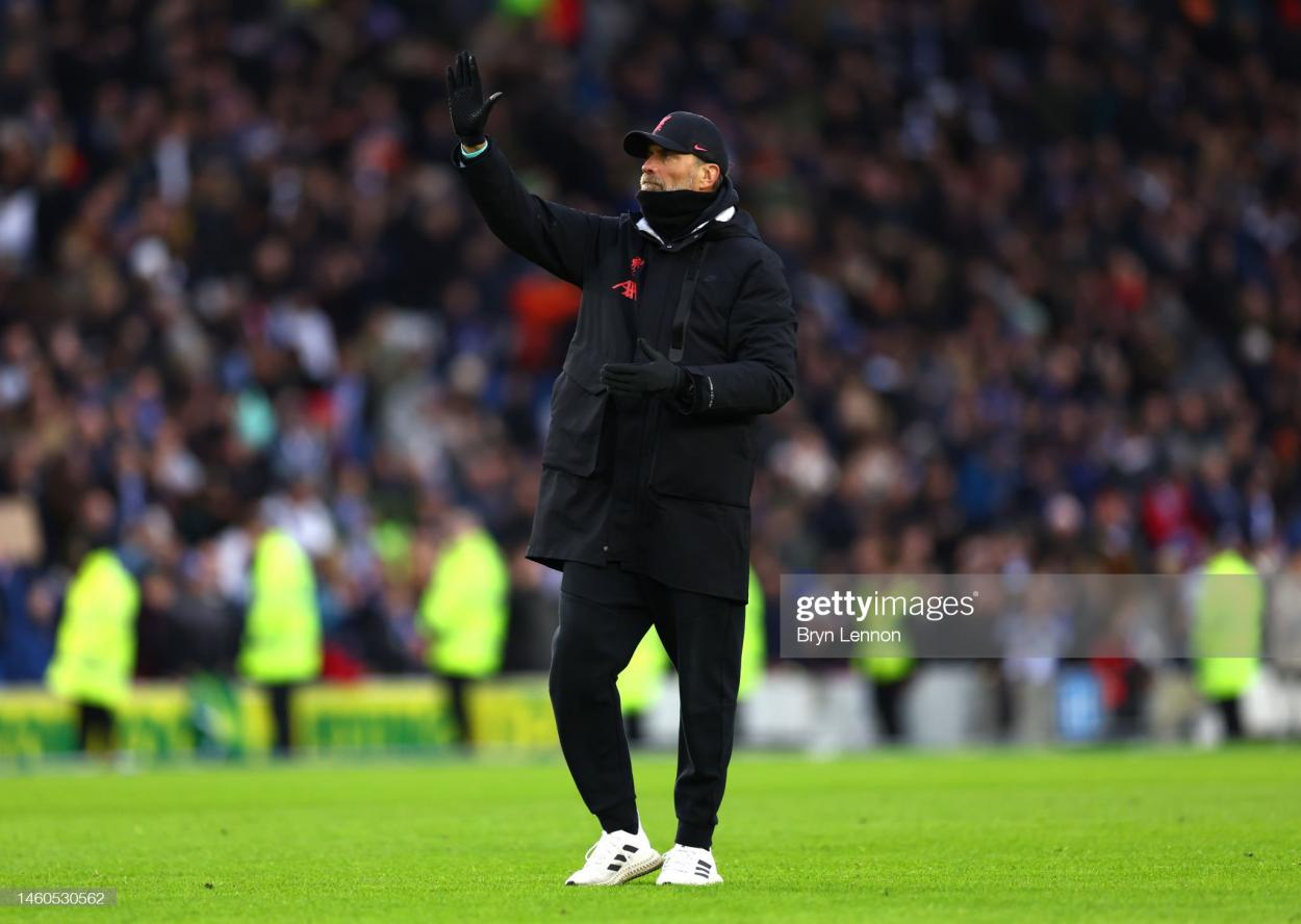 Liverpool manager Jürgen Klopp acknowledges supporters after the team's 2-1 FA Cup fourth round defeat at Brighton on 29th January 2023 (Photo by Bryn Lennon/Getty Images)