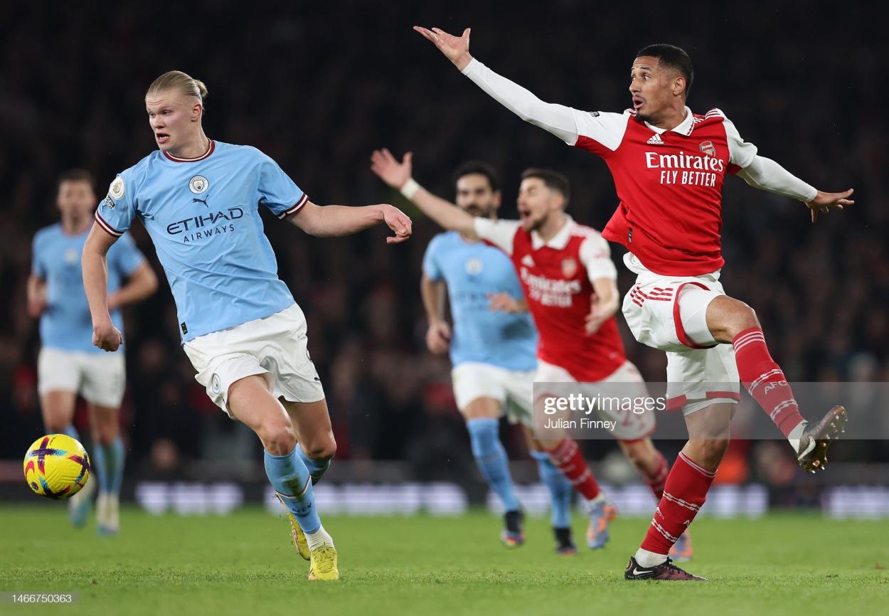 ONDON, ENGLAND - FEBRUARY 15: Erling Haaland of <strong><a  data-cke-saved-href='https://www.vavel.com/en/football/2023/03/16/premier-league/1140842-four-things-we-learnt-from-brentfords-victory-against-southampton.html' href='https://www.vavel.com/en/football/2023/03/16/premier-league/1140842-four-things-we-learnt-from-brentfords-victory-against-southampton.html'>Manchester City</a></strong> moves away from William Saliba of Arsenal during the <strong><a  data-cke-saved-href='https://www.vavel.com/en/football/2023/03/20/premier-league/1141302-why-ex-man-city-talent-could-be-key-to-premier-league-survival-for-leeds.html' href='https://www.vavel.com/en/football/2023/03/20/premier-league/1141302-why-ex-man-city-talent-could-be-key-to-premier-league-survival-for-leeds.html'>Premier League</a></strong> match between Arsenal FC and <strong><a  data-cke-saved-href='https://www.vavel.com/en/football/2023/03/16/premier-league/1140842-four-things-we-learnt-from-brentfords-victory-against-southampton.html' href='https://www.vavel.com/en/football/2023/03/16/premier-league/1140842-four-things-we-learnt-from-brentfords-victory-against-southampton.html'>Manchester City</a></strong> at Emirates Stadium on February 15, 2023 in London, England. (Photo by Julian Finney/Getty Images)