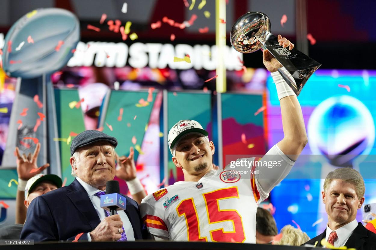  Patrick Mahomes #15 of the Kansas City Chiefs hoists the Lombardi Trophy against the Philadelphia Eagles after Super Bowl LVII at State Farm Stadium on February 12, 2023 in Glendale, Arizona. The Chiefs defeated the Eagles 38-35. (Photo by Cooper Neill/Getty Images)