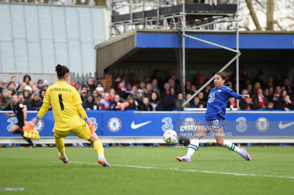 Sam Kerr of Chelsea scores her team's second goal past Manuela Zinsberger of Arsenal during the Vitality Women's FA Cup Fifth Round match between Chelsea and Arsenal at Kingsmeadow on February 26, 2023 in Kingston upon Thames, England. (Photo by Harriet Lander - Chelsea FC/Chelsea FC via Getty Images)