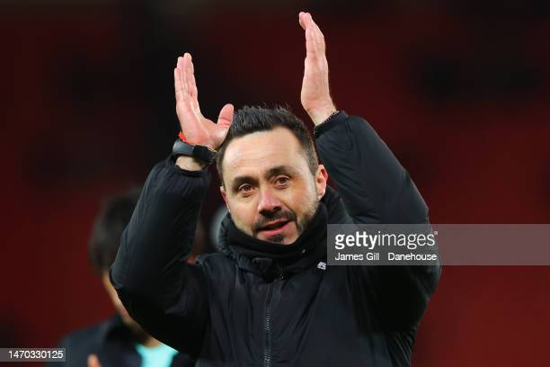 Manager Roberto De Zerbi applauds the travelling fans following their win against Stoke in the FA Cup - 