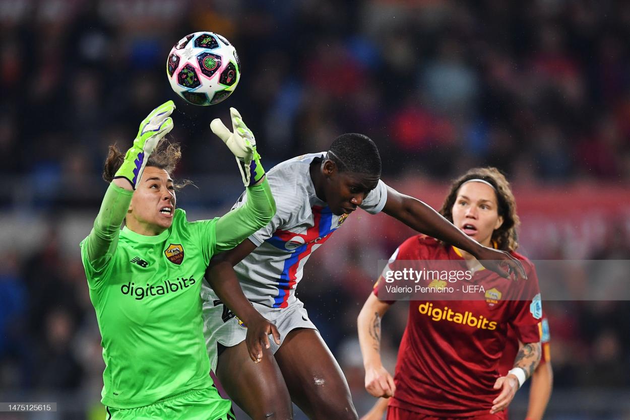 Camelia Ceasar of AS Roma jumps to make a save against <strong><a  data-cke-saved-href='https://www.vavel.com/en/football/2020/08/19/womens-football/1033126-atletico-madrid-vs-fc-barcelona-uwcl-preview-all-spanish-tie-in-quarter-finals.html' href='https://www.vavel.com/en/football/2020/08/19/womens-football/1033126-atletico-madrid-vs-fc-barcelona-uwcl-preview-all-spanish-tie-in-quarter-finals.html'>Asisat Oshoala</a></strong> of FC Barcelona during the UEFA Women's Champions League quarter-final 1st leg match between AS Roma and FC Barcelona at Stadio Tre Fontane on March 21, 2023 in Rome, Italy. (Photo by Valerio Pennicino - UEFA/UEFA via Getty Images)