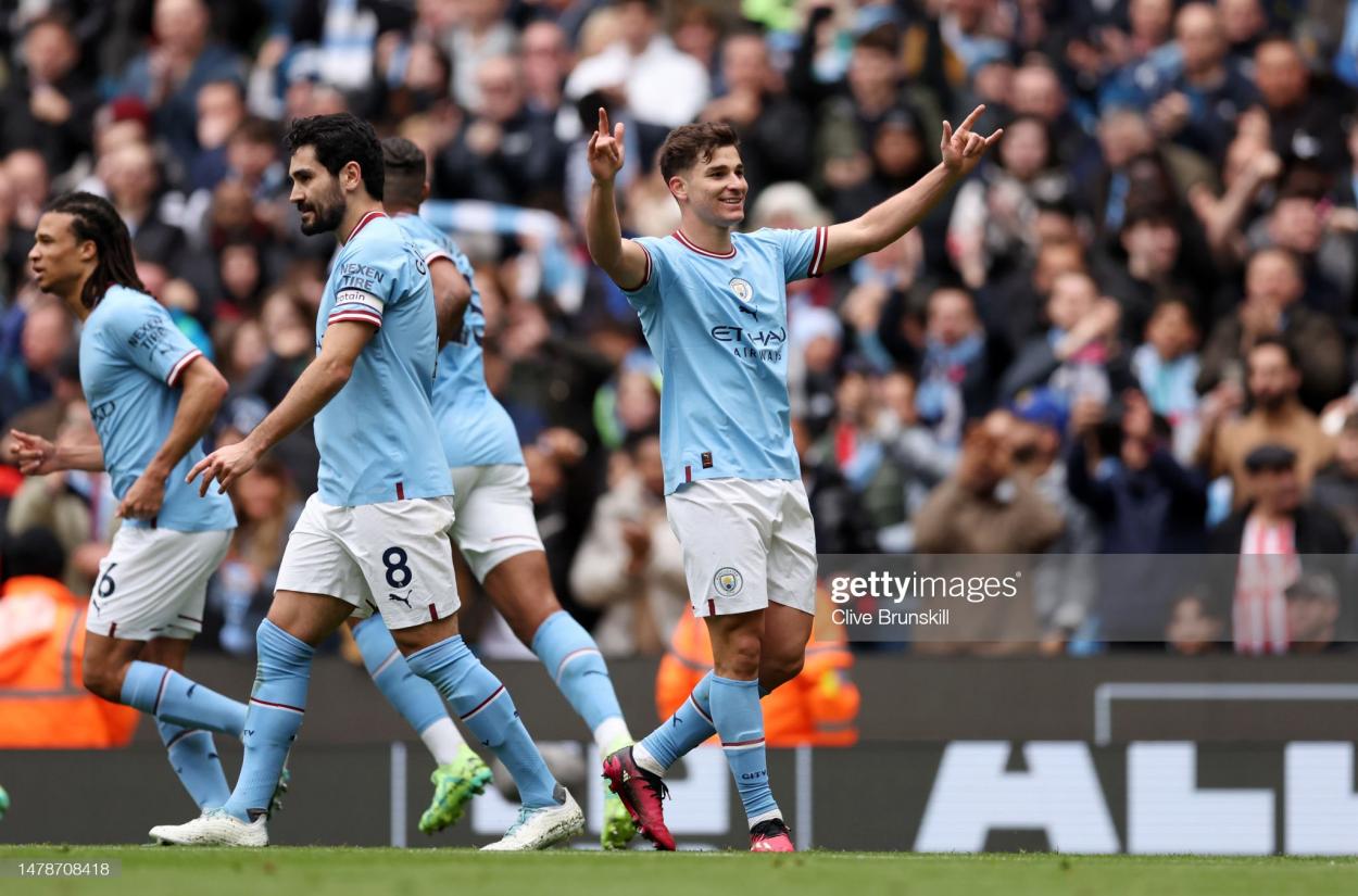 <strong><a  data-cke-saved-href='https://www.vavel.com/en/football/2023/03/16/manchester-city/1140863-julian-alvarez-signs-extended-contract-with-manchester-city.html' href='https://www.vavel.com/en/football/2023/03/16/manchester-city/1140863-julian-alvarez-signs-extended-contract-with-manchester-city.html'>Julian Alvarez</a></strong> celebrates in front of the <strong><a  data-cke-saved-href='https://www.vavel.com/en/football/2023/03/31/premier-league/1142328.html' href='https://www.vavel.com/en/football/2023/03/31/premier-league/1142328.html'>Manchester City</a></strong> home fans  (Photo by Clive Brunskill/Getty Images)