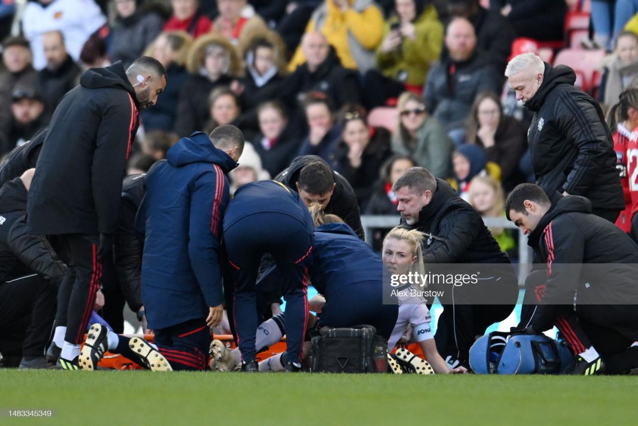 Leah Williamson of Arsenal looks on while receiving medical treatment during the FA Women's Super League match between Manchester United and Arsenal at Leigh Sports Village on April 19, 2023 in Leigh, England. (Photo by Alex Burstow/Arsenal FC via Getty Images)