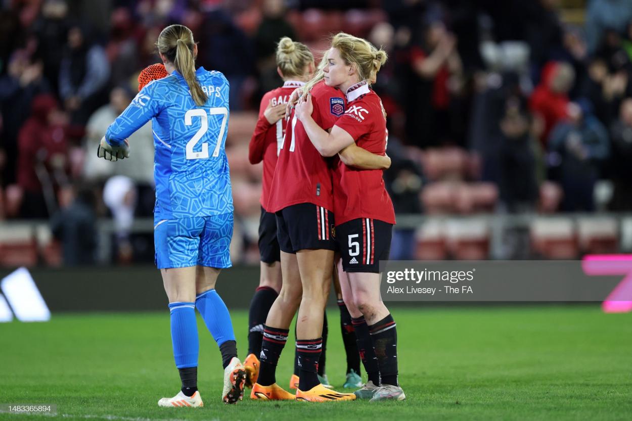 Aoife Mannion of Manchester United celebrates victory with teammate Millie Turner following the FA Women's Super League match between Manchester United and Arsenal at Leigh Sports Village on April 19, 2023 in Leigh, England. (Photo by Alex Livesey - The FA/The FA via Getty Images)
