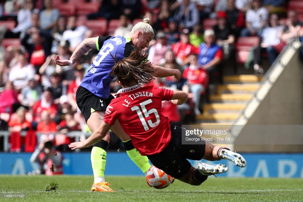 Bethany England of Tottenham Hotspur has their shot saved by a tackle from <strong><a  data-cke-saved-href='https://www.vavel.com/en/football/2021/01/29/womens-football/1057072-bristol-city-vs-brighton-womens-super-league-how-to-watch-kick-off-times-team-news-predicted-line-ups-and-ones-to-watch.html' href='https://www.vavel.com/en/football/2021/01/29/womens-football/1057072-bristol-city-vs-brighton-womens-super-league-how-to-watch-kick-off-times-team-news-predicted-line-ups-and-ones-to-watch.html'>Maya Le Tissier</a></strong> of <strong><a  data-cke-saved-href='https://www.vavel.com/en/football/2023/05/05/womens-football/1145887-melissa-phillips-our-belief-to-win-is-growing.html' href='https://www.vavel.com/en/football/2023/05/05/womens-football/1145887-melissa-phillips-our-belief-to-win-is-growing.html'>Manchester United</a></strong> during the FA Women's Super League match between <strong><a  data-cke-saved-href='https://www.vavel.com/en/football/2023/05/05/womens-football/1145887-melissa-phillips-our-belief-to-win-is-growing.html' href='https://www.vavel.com/en/football/2023/05/05/womens-football/1145887-melissa-phillips-our-belief-to-win-is-growing.html'>Manchester United</a></strong> and Tottenham Hotspur at <strong><a  data-cke-saved-href='https://www.vavel.com/en/football/2023/04/14/womens-football/1143716-man-united-vs-brighton-vitality-womens-fa-cup-preview-semi-final-2023.html' href='https://www.vavel.com/en/football/2023/04/14/womens-football/1143716-man-united-vs-brighton-vitality-womens-fa-cup-preview-semi-final-2023.html'>Leigh Sports Village</a></strong> on May 07, 2023 in Leigh, England. (Photo by George Wood - The FA/The FA via Getty Images)