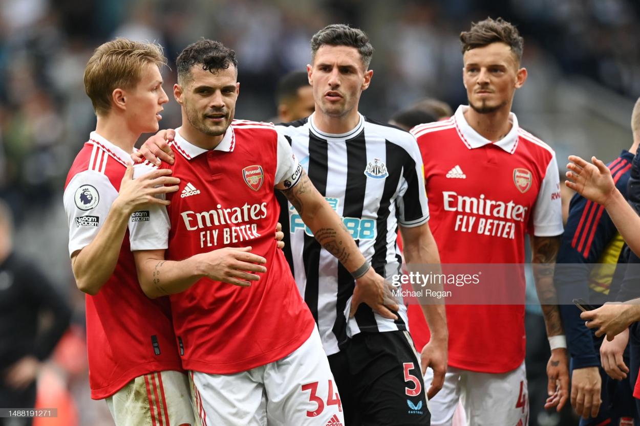 Martin Odegaard and Granit Xhaka of Arsenal clash with Fabian Schaer of Newcastle United following the Premier League match between Newcastle United and Arsenal FC.(Photo by Michael Regan/Getty Images)
