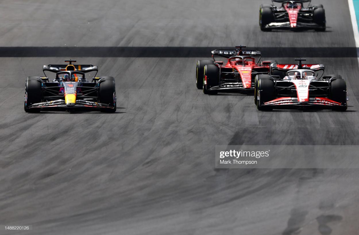 MIAMI, FLORIDA - MAY 07: Max Verstappen of the Netherlands driving the (1) Oracle Red Bull Racing RB19 overtakes <strong><a  data-cke-saved-href='https://www.vavel.com/en/motorsports/2022/03/25/formula-1/1106358-gp-arabia-saudifree-practice1-the-battle-continues.html' href='https://www.vavel.com/en/motorsports/2022/03/25/formula-1/1106358-gp-arabia-saudifree-practice1-the-battle-continues.html'>Kevin Magnussen</a></strong> of Denmark driving the (20) Haas F1 VF-23 Ferrari and <strong><a  data-cke-saved-href='https://www.vavel.com/en/motorsports/2023/03/21/formula-1/1141349-former-world-champion-fittipaldi-believes-ferrari-will-improve.html' href='https://www.vavel.com/en/motorsports/2023/03/21/formula-1/1141349-former-world-champion-fittipaldi-believes-ferrari-will-improve.html'>Charles Leclerc</a></strong> of Monaco driving the (16) Ferrari SF-23 during the F1 Grand Prix of Miami at Miami International Autodrome on May 07, 2023 in Miami, Florida. (Photo by Mark Thompson/Getty Images)