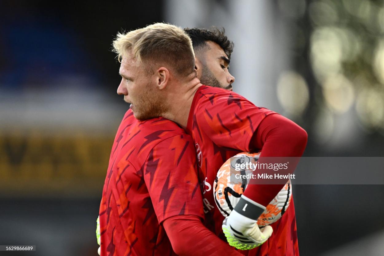 LONDON, ENGLAND - AUGUST 21: Aaron Ramsdale and David Raya of Arsenal embrace as they warm up prior to the Premier League match between Crystal Palace and Arsenal FC at Selhurst Park on August 21, 2023 in London, England. (Photo by Mike Hewitt/Getty Images)