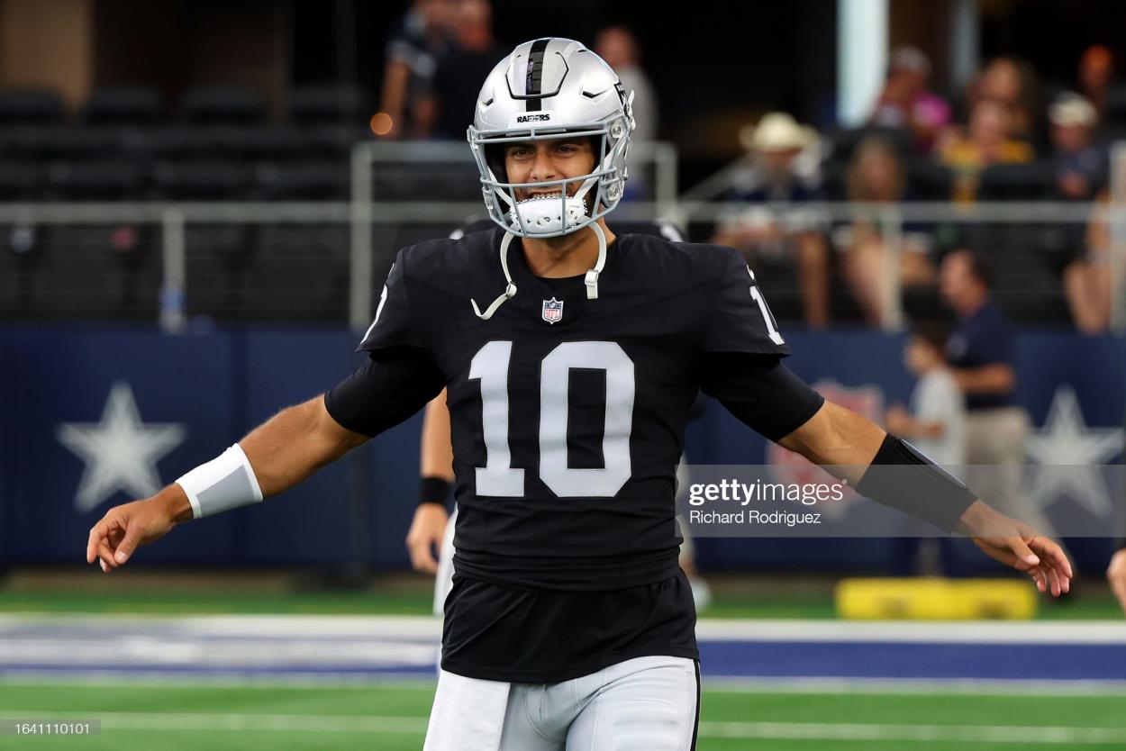 Jimmy Garoppolo #10 of the Las Vegas Raiders warms up before a preseason game against the Dallas Cowboys at AT&T Stadium on August 26, 2023 in Arlington, Texas. (Photo by Richard Rodriguez/Getty Images)