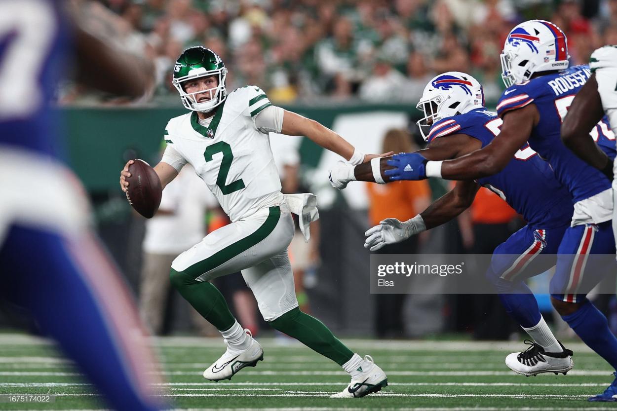 Quarterback Zach Wilson #2 of the New York Jets scrambles with the football during the third quarter of the NFL game against the Buffalo Bills at MetLife Stadium on September 11, 2023 in East Rutherford, New Jersey. (Photo by Elsa/Getty Images)