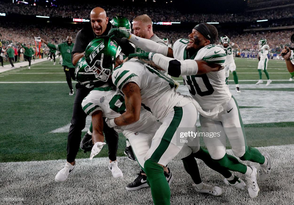 Wide receiver Xavier Gipson #82 of the New York Jets celebrates with Allen Lazard #10, Michael Carter II #30 and head coach Robert Saleh after scoring the game winning touchdown on a 65-yard punt return during the overtime quarter of the NFL game against the Buffalo Bills at MetLife Stadium on September 11, 2023 in East Rutherford, New Jersey. The Jets defeated the Bills 22-16 in overtime. (Photo by Elsa/Getty Images)