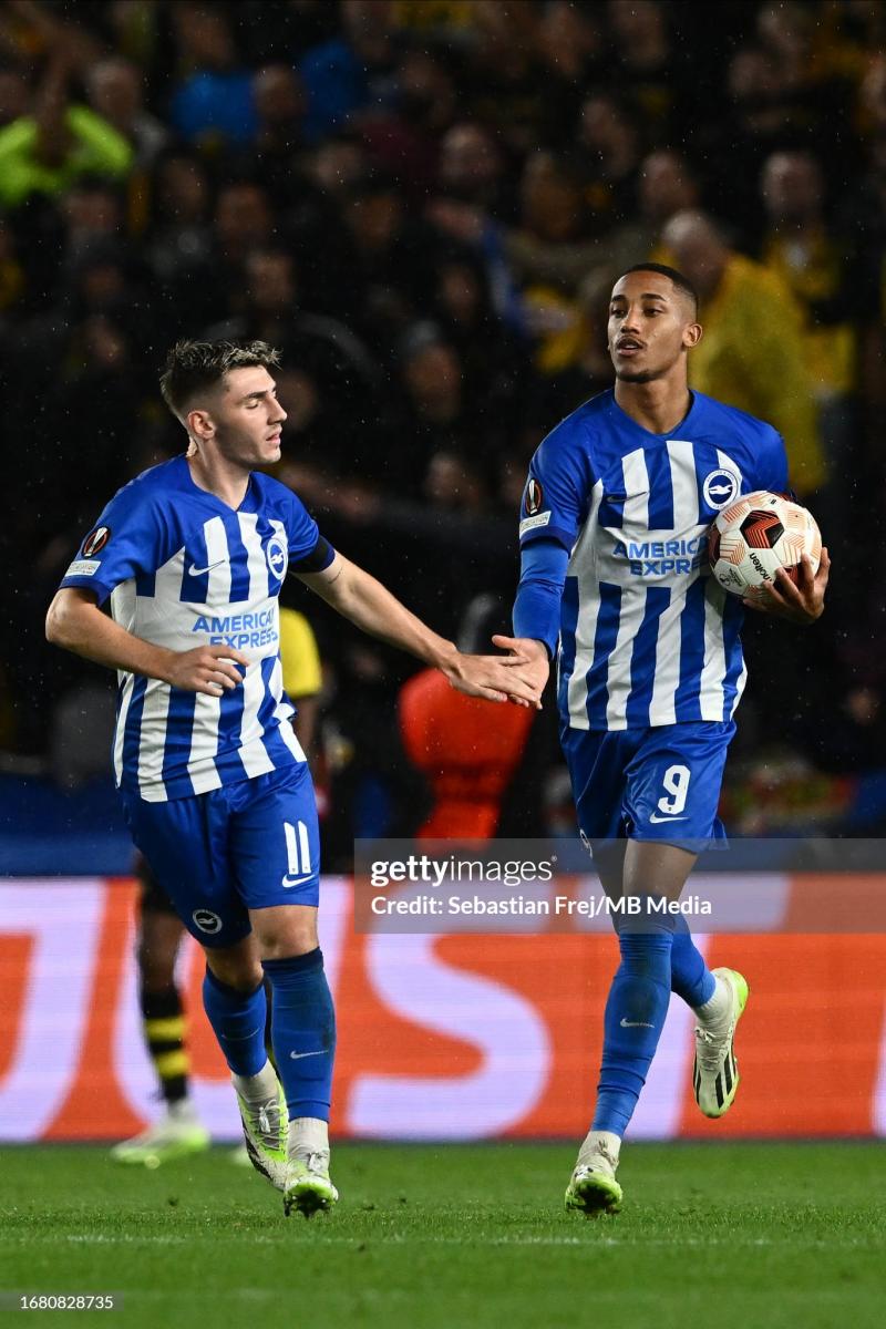 Joao Pedro retrieves the match ball after bringing Brighton back level from the penalty spot. (Photo by Alex Pantling/Getty Images)