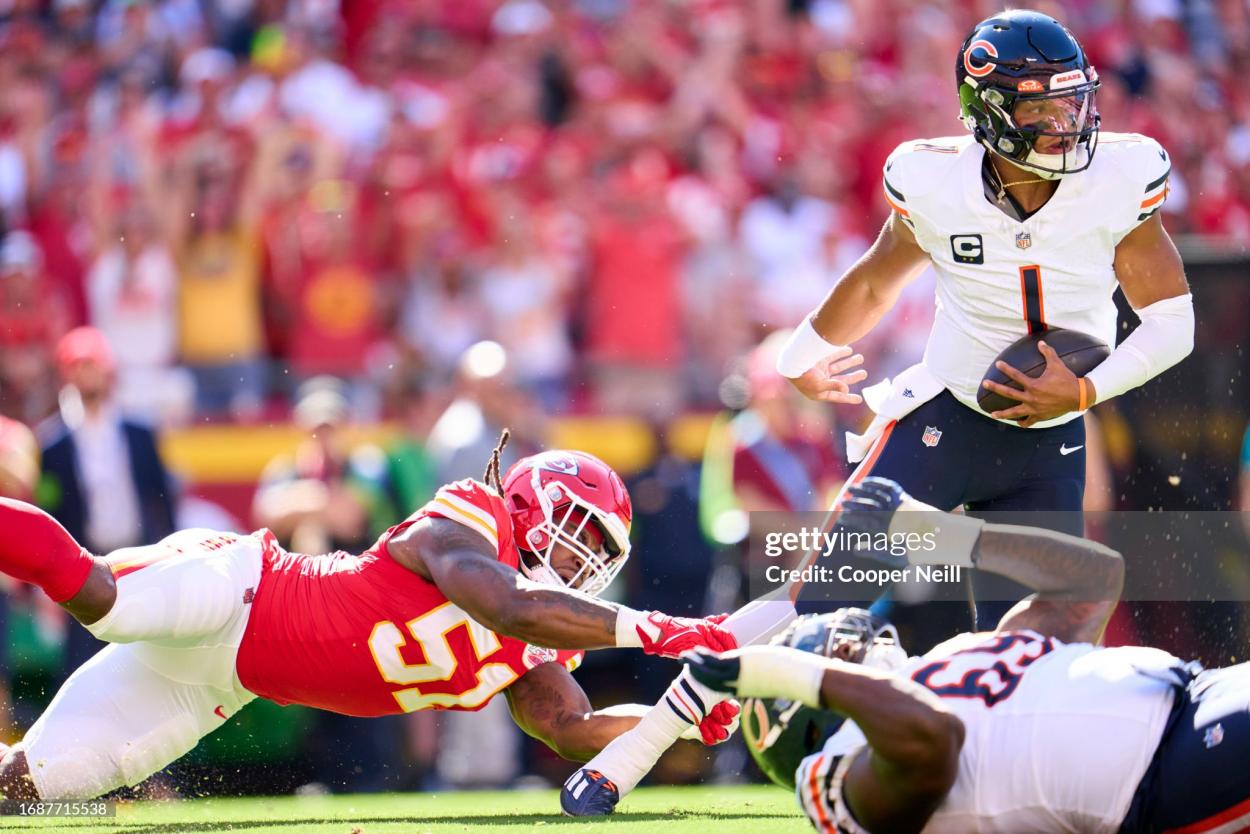 Justin Fields #1 of the Chicago Bears breaks a tackle against the Kansas City Chiefs during the first half at GEHA Field at Arrowhead Stadium on September 24, 2023 in Kansas City, Missouri. (Photo by Cooper Neill/Getty Images)
