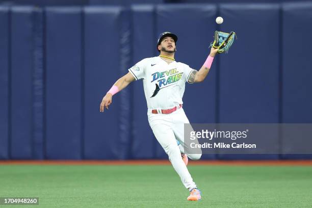 Tampa Bay left fielder Jose Siri misplays a ball that led to Texas' fourth run/Photo: Mike Carlson/MLB Photos via Getty Images
