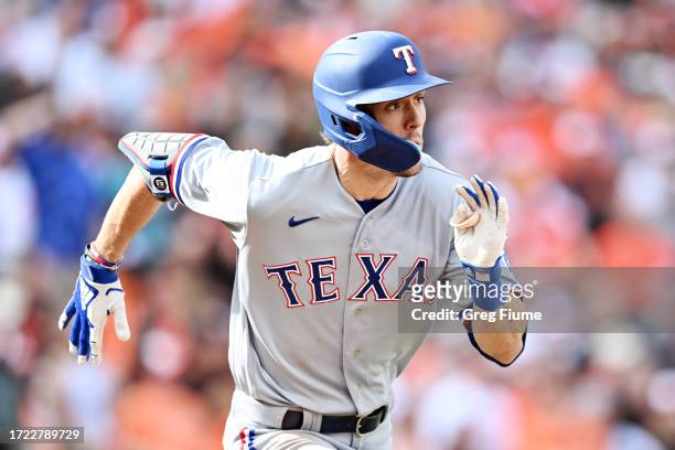 Evan Carter runs to first after hitting an RBI double in Texas' Game 1 win/Photo: Greg Fiume/Getty Images