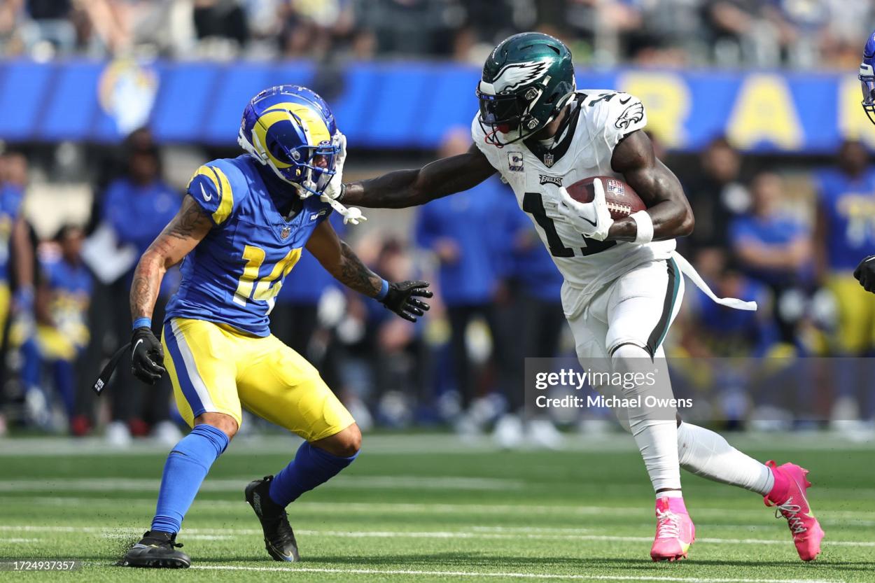 A.J. Brown #11 of the Philadelphia Eagles stiff arms Cobie Durant #14 of the Los Angeles Rams an NFL football game between the Los Angeles Rams and the Philadelphia Eagles at SoFi Stadium on October 08, 2023 in Inglewood, California. (Photo by Michael Owens/Getty Images)