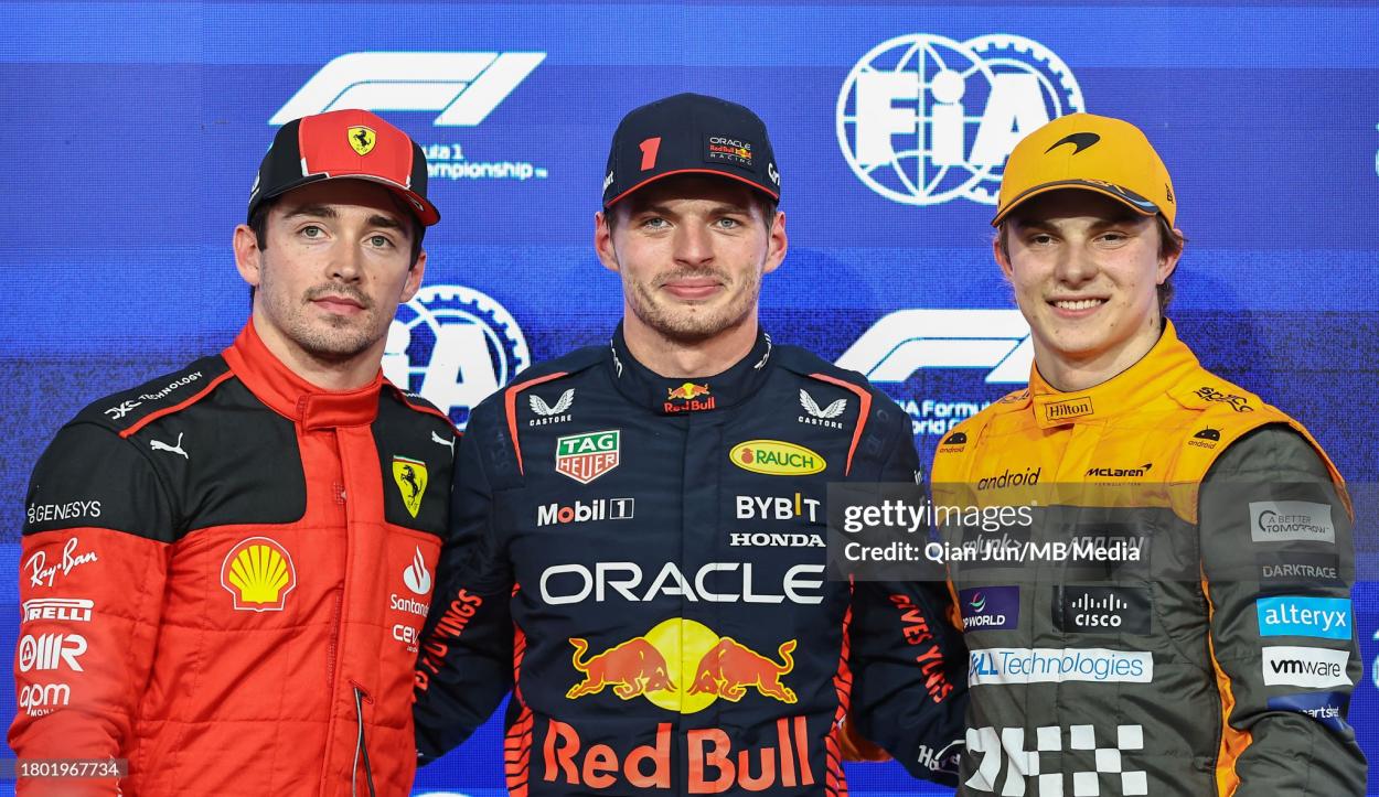 Charles Leclerc of Monaco and Scuderia Ferrari, Max Verstappen of the Netherlands and Oracle Red Bull Racing and Oscar Piastri of Australia and McLaren F1 Team in parc feme during qualifying ahead of the F1 Grand Prix of Abu Dhabi at Yas Marina Circuit on November 25, 2023 in Abu Dhabi, United Arab Emirates. (Photo by Qian Jun/MB Media/Getty Images)
