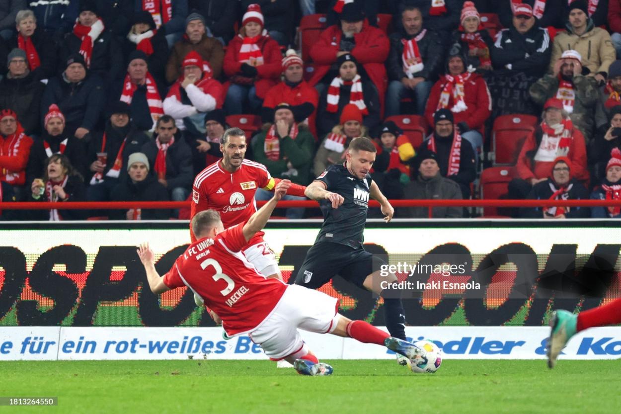 BERLIN, GERMANY - NOVEMBER 25: Paul Jaeckel from 1. FC <strong><a  data-cke-saved-href='https://www.vavel.com/en/international-football/2023/11/22/germany-bundesliga/1163806-1-fc-koln-vs-bayern-munich-bundesliga-preview-gameweek-12-2023.html' href='https://www.vavel.com/en/international-football/2023/11/22/germany-bundesliga/1163806-1-fc-koln-vs-bayern-munich-bundesliga-preview-gameweek-12-2023.html'>Union Berlin</a></strong> tackles while Christopher Trimmel from 1. FC <strong><a  data-cke-saved-href='https://www.vavel.com/en/international-football/2023/11/22/germany-bundesliga/1163806-1-fc-koln-vs-bayern-munich-bundesliga-preview-gameweek-12-2023.html' href='https://www.vavel.com/en/international-football/2023/11/22/germany-bundesliga/1163806-1-fc-koln-vs-bayern-munich-bundesliga-preview-gameweek-12-2023.html'>Union Berlin</a></strong> follows during the Bundesliga match between 1. FC <strong><a  data-cke-saved-href='https://www.vavel.com/en/international-football/2023/11/15/germany-bundesliga/1163058-union-berlin-president-says-he-was-afraid-of-urs-fischers-departure-as-union-berlin-manager.html' href='https://www.vavel.com/en/international-football/2023/11/15/germany-bundesliga/1163058-union-berlin-president-says-he-was-afraid-of-urs-fischers-departure-as-union-berlin-manager.html'>Union Berlin</a></strong> and FC Augsburg at An der Alten Foersterei on November 25, 2023 in Berlin, Germany. (Photo by Inaki Esnaola/Getty Images)