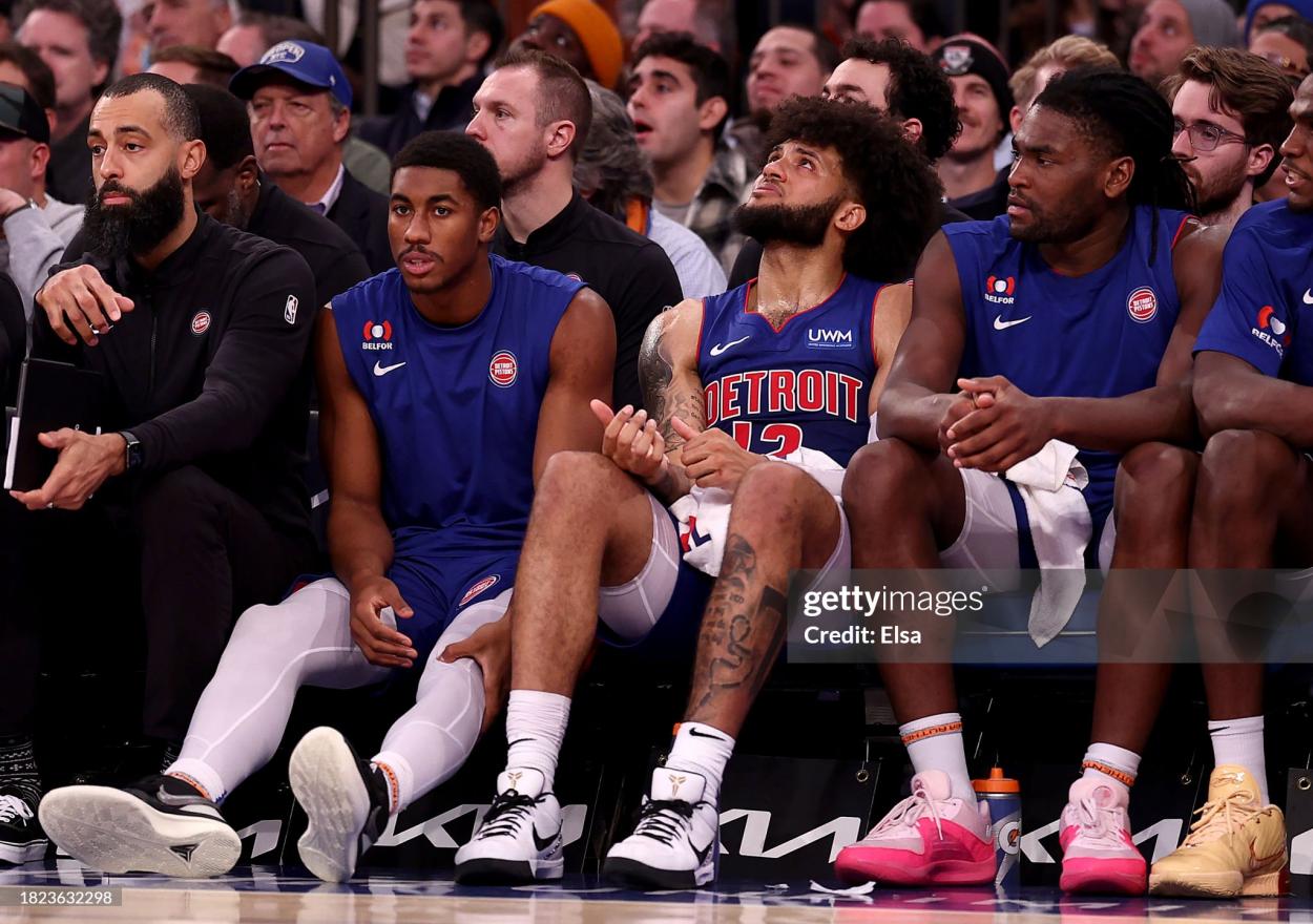 The deflated Detroit bench looks on (Photo by Elsa/Getty Images)