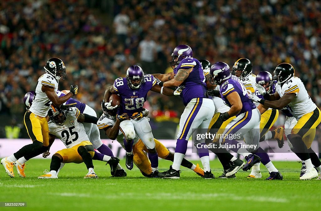 LONDON, ENGLAND - SEPTEMBER 29: Running back Adrian Peterson #28 of the Minnesota Vikings attemps turnover break through the defense during the NFL International Series game between Pittsburgh Steelers and Minnesota Vikings at Wembley Stadium on September 29, 2013 in London, England. (Photo by Julian Finney/Getty Images)