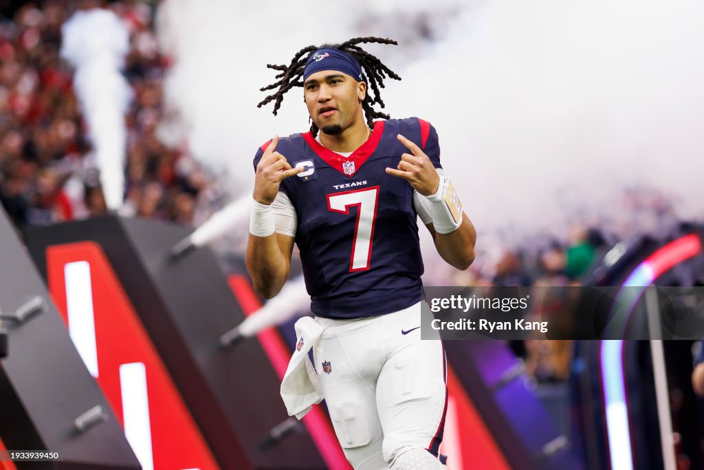 HOUSTON, TEXAS - JANUARY 13: C.J. Stroud #7 of the Houston Texans celebrates as he runs onto the field during player introductions before an AFC wild-card playoff football game against the Cleveland Browns at NRG Stadium on January 13, 2024 in Houston, Texas. (Photo by Ryan Kang/Getty Images)