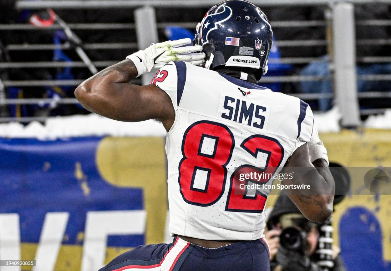 BALTIMORE, MD - JANUARY 20: Houston Texans wide receiver Steven Sims (82) listens for the crowd reaction after returning a punt for a touchdown during the Houston Texans game versus the Baltimore Ravens in the AFC Divisional Playoffs on January 20, 2024 at M&T Bank Stadium in Baltimore, MD. (Photo by Mark Goldman/Icon Sportswire via Getty Images)