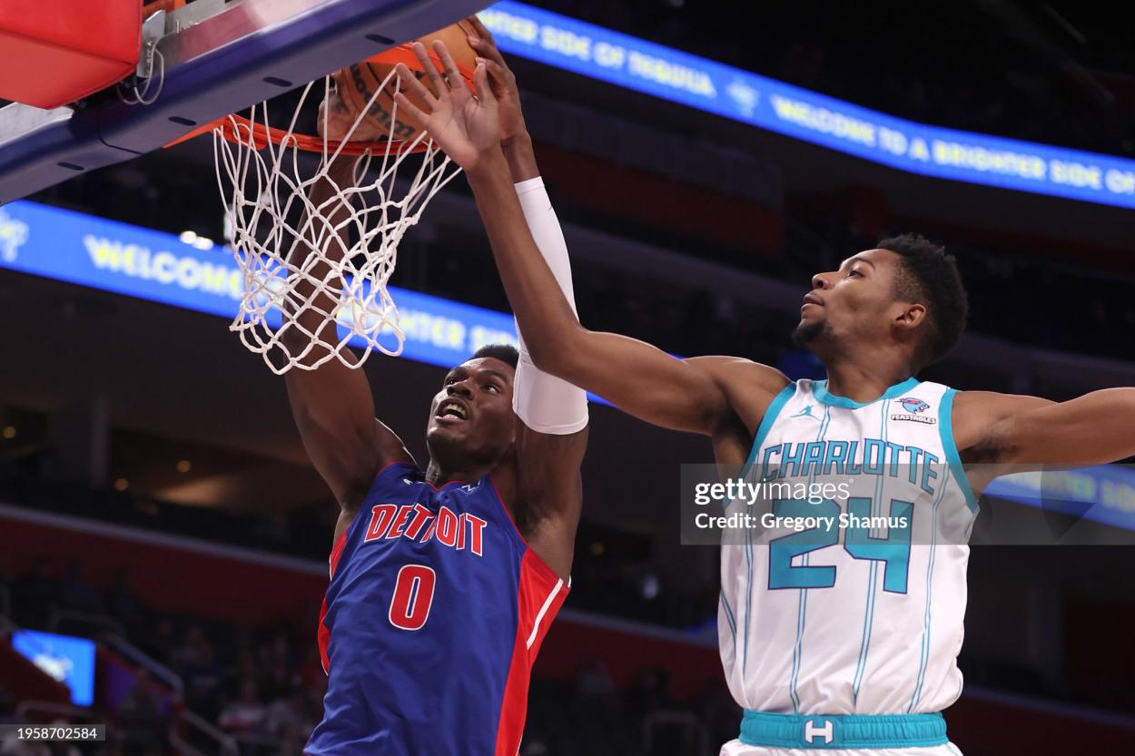 DETROIT, MICHIGAN - JANUARY 24: Jalen Duren #0 of the Detroit Pistons dunks next to Brandon Miller #24 of the Charlotte Hornets during the first half at Little Caesars Arena on January 24, 2024 in Detroit, Michigan. NOTE TO USER: User expressly acknowledges and agrees that, by downloading and or using this photograph, User is consenting to the terms and conditions of the Getty Images License (Photo by Gregory Shamus/Getty Images)