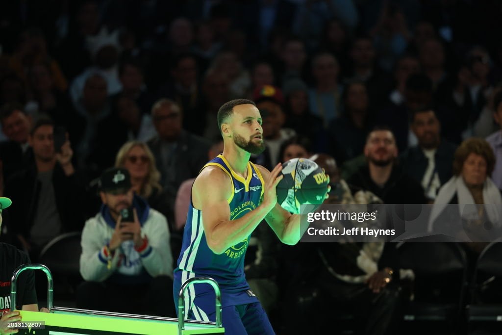 INDIANAPOLIS, IN - FEBRUARY 17: Stephen Curry #30 of the <strong><a  data-cke-saved-href='https://www.vavel.com/en-us/nba/2024/01/18/1169068-andre-iguodalablackrock-of-basketball.html' href='https://www.vavel.com/en-us/nba/2024/01/18/1169068-andre-iguodalablackrock-of-basketball.html'>Golden State Warriors</a></strong> shoots a 3-point basket during the Stephen vs Sabrina 3-point Challenge as a part of State Farm All-Star Saturday Night on Saturday, February 17, 2024 at Lucas Oil Stadium in Indianapolis, Indiana. NOTE TO USER: User expressly acknowledges and agrees that, by downloading and/or using this Photograph, user is consenting to the terms and conditions of the Getty Images License Agreement. Mandatory Copyright Notice: Copyright 2024 NBAE (Photo by Jeff Haynes/NBAE via Getty Images)