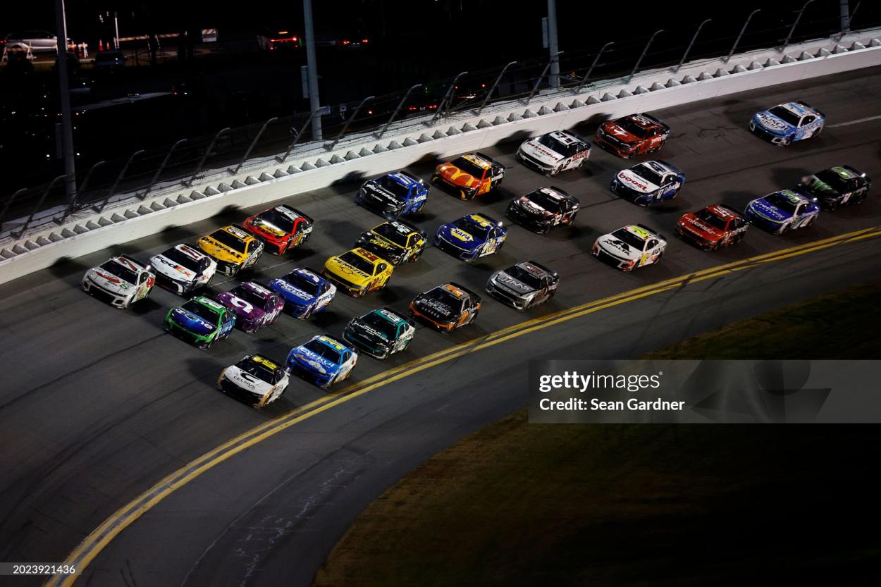 DAYTONA BEACH, FLORIDA - FEBRUARY 19: AJ Allmendinger, driver of the #16 Celsius Chevrolet, Kyle Busch, driver of the #8 Zone Chevrolet, and Corey LaJoie, driver of the #7 Chili's Catch-a-Rita Chevrolet, lead the field during the NASCAR Cup Series Daytona 500 at Daytona International Speedway on February 19, 2024 in Daytona Beach, Florida. (Photo by Sean Gardner/Getty Images)