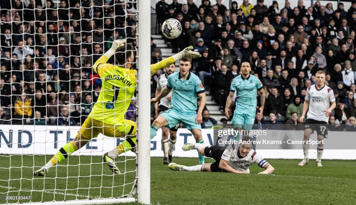 George Thomason (centre) shoots at goal during the Sky Bet League One match between Derby County and Bolton Wanderers at Pride Park Stadium on March 16, 2024 in Derby, United Kingdom. (Photo by Andrew Kearns - CameraSport via Getty Images)