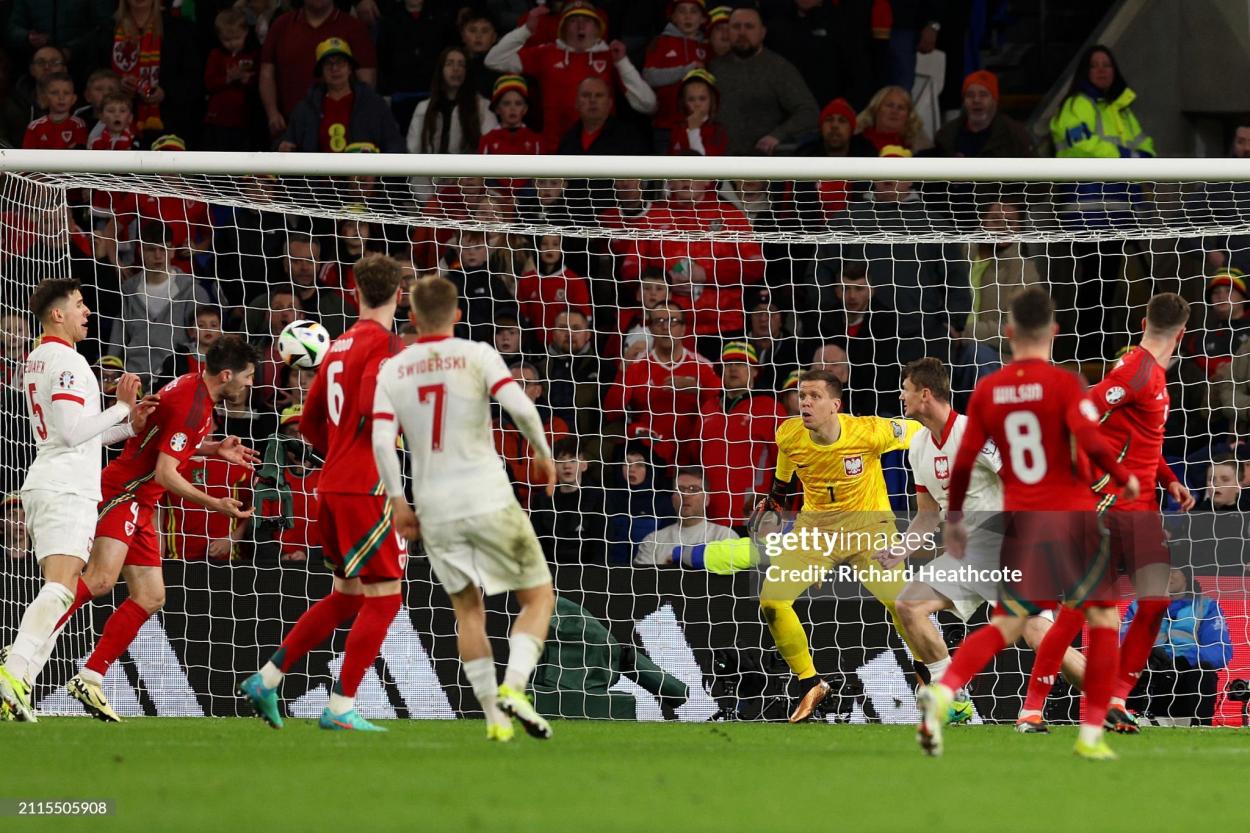 CARDIFF, WALES - MARCH 26: Wojciech Szczesny of Poland reacts as Ben Davies of Wales scores a goal which is later disallowed for offside following a VAR review during the UEFA EURO 2024 Play-Offs Final match between Wales and Poland at Cardiff City Stadium on March 26, 2024 in Cardiff, Wales. (Photo by Richard Heathcote/Getty Images)