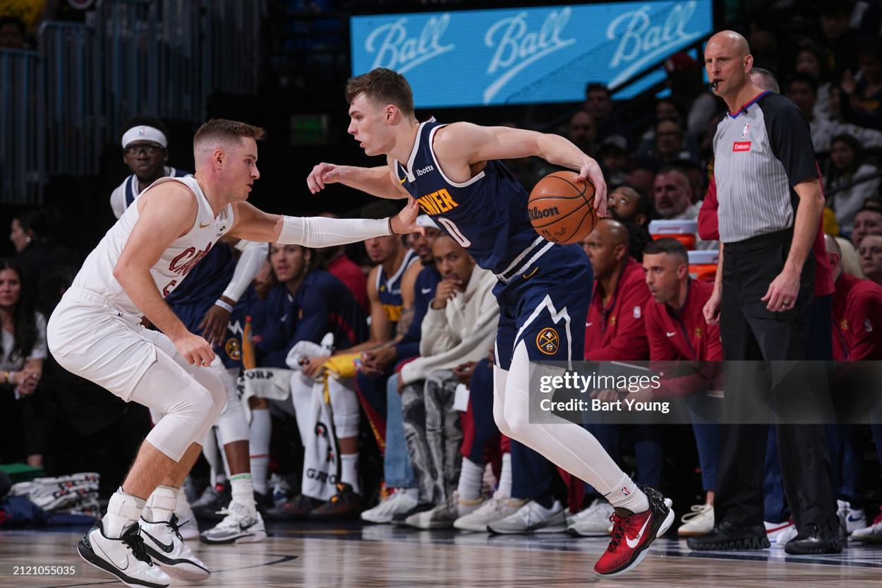 Christian Braun takes on Sam Merrill (Photo by Bart Young/NBAE via Getty Images)