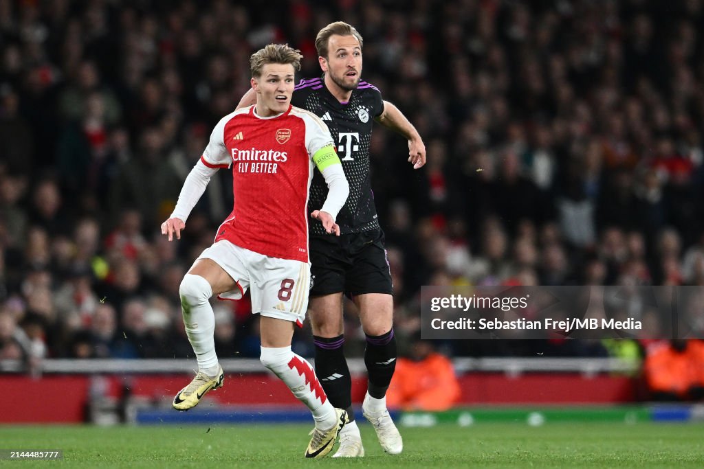 Martin Odegaard of Arsenal and Harry Kane of FC Bayern Munchen in action during the <strong><a  data-cke-saved-href='https://www.vavel.com/en-us/soccer/2024/03/13/1175899-atleticomadrid-vs-inter-milan-match-preview-score-to-settle-in-madrid.html' href='https://www.vavel.com/en-us/soccer/2024/03/13/1175899-atleticomadrid-vs-inter-milan-match-preview-score-to-settle-in-madrid.html'>UEFA Champions League</a></strong> quarter-final first leg match between Arsenal FC and FC Bayern Munchen at Emirates Stadium on April 9, 2024 in London, England.(Photo by Sebastian Frej/MB Media/Getty Images)