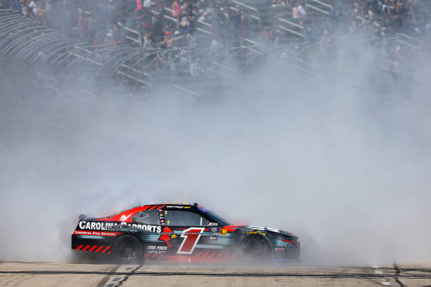 Sam Mayer, driver of the #1 Carolina Carports Chevrolet, celebrates with a burnout after winning the NASCAR Xfinity Series Andy's Frozen Custard 300 at Texas Motor Speedway on April 13, 2024 in Fort Worth, Texas. (Photo by Jared C. Tilton/Getty Images)