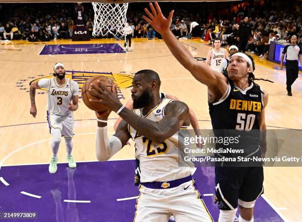 Los Angeles, CA - April 27: LeBron James #23 of the Los Angeles Lakers passes over Aaron Gordon #50 of the <strong><a  data-cke-saved-href='https://www.vavel.com/en-us/nba/2024/03/31/1178129-nikola-jokic-produces-triple-double-as-denver-blowout-cleveland-to-clinch-a-play-off-spot.html' href='https://www.vavel.com/en-us/nba/2024/03/31/1178129-nikola-jokic-produces-triple-double-as-denver-blowout-cleveland-to-clinch-a-play-off-spot.html'>Denver Nuggets</a></strong> in the second half of game 4 of a first round NBA playoff basketball game at Crypto.com Arena in Los Angeles on Saturday, April 27, 2024. (Photo by Keith Birmingham/MediaNews Group/Pasadena Star-News via Getty Images)