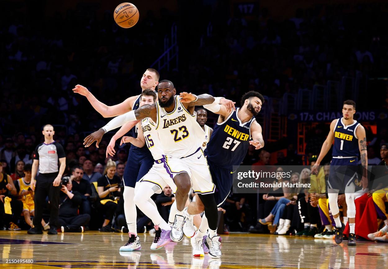 LeBron James steals the ball from <strong><a  data-cke-saved-href='https://www.vavel.com/en-us/nba/2024/03/31/1178129-nikola-jokic-produces-triple-double-as-denver-blowout-cleveland-to-clinch-a-play-off-spot.html' href='https://www.vavel.com/en-us/nba/2024/03/31/1178129-nikola-jokic-produces-triple-double-as-denver-blowout-cleveland-to-clinch-a-play-off-spot.html'>Nikola Jokic</a></strong> (Photo by Ronald Martinez/Getty Images)