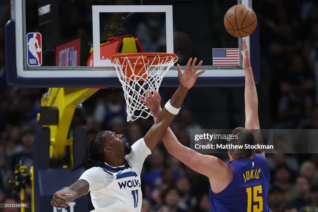 DENVER, COLORADO - MAY 04: Nikola Jokic #15 of the Denver Nuggets puts up a shot against Naz Reid #11 of the Minnesota Timberwolves in the third quarter during Game One of the Western Conference Second Round Playoffs at Ball Arena on May 04, 2024 in Denver, Colorado. NOTE TO USER: User expressly acknowledges and agrees that, by downloading and or using this photograph, User is consenting to the terms and conditions of the Getty Images License Agreement. (Photo by Matthew Stockman/Getty Images)