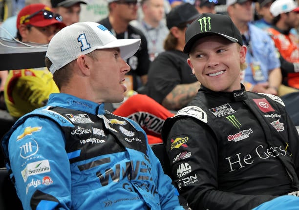 Ty Gibbs, driver of the #54 He Gets Us Toyota, (R) and Ross Chastain, driver of the #1 Worldwide Express Chevrolet, talk during the drivers meeting prior to the NASCAR Cup Series Bass Pro Shops Night Race at Bristol Motor Speedway on September 21, 2024 in Bristol, Tennessee. (Photo by Jonathan Bachman/Getty Images)