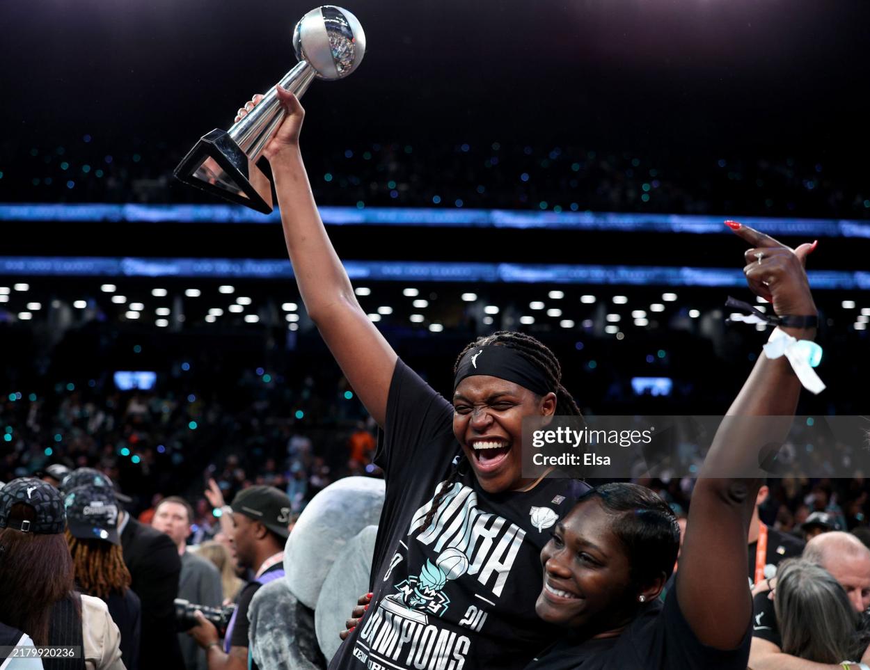 Jonquel Jones #35 of the New York Liberty celebrates with the WBNA Finals MVP trophy after winning Game Five of the WNBA Finals at Barclays Center on October 20, 2024 in New York City. (Photo by Elsa/Getty Images)