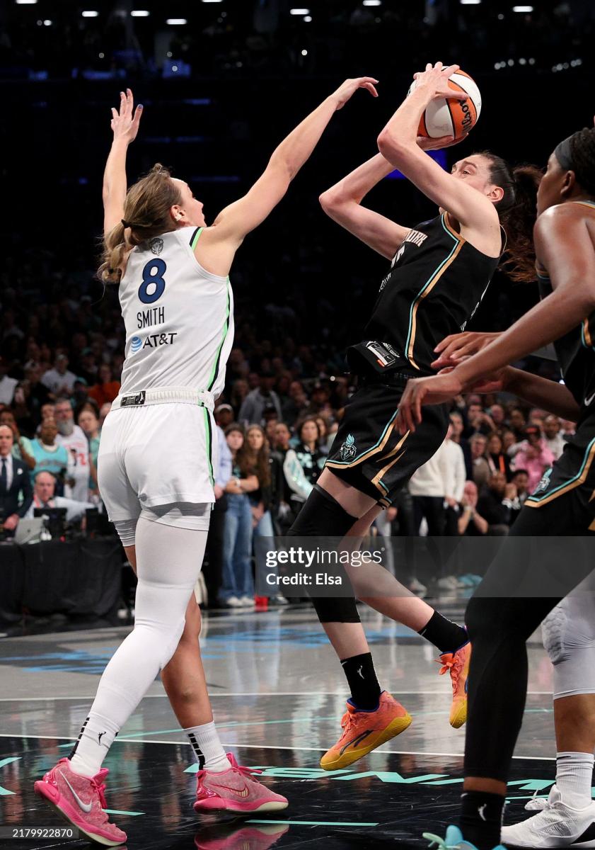 Breanna Stewart #30 of the New York Liberty takes a shot as Alanna Smith #8 of the Minnesota Lynx defends during Game Five of the WNBA Finals at Barclays Center on October 20, 2024 in the Brooklyn borough of New York City. Smith was called for a foul on the play. The New York Liberty defeated the Minnesota Lynx 67-62 in overtime to win the championship. NOTE TO USER: User expressly acknowledges and agrees that, by downloading and or using this photograph, User is consenting to the terms and conditions of the Getty Images License Agreement. (Photo by Elsa/Getty Images)