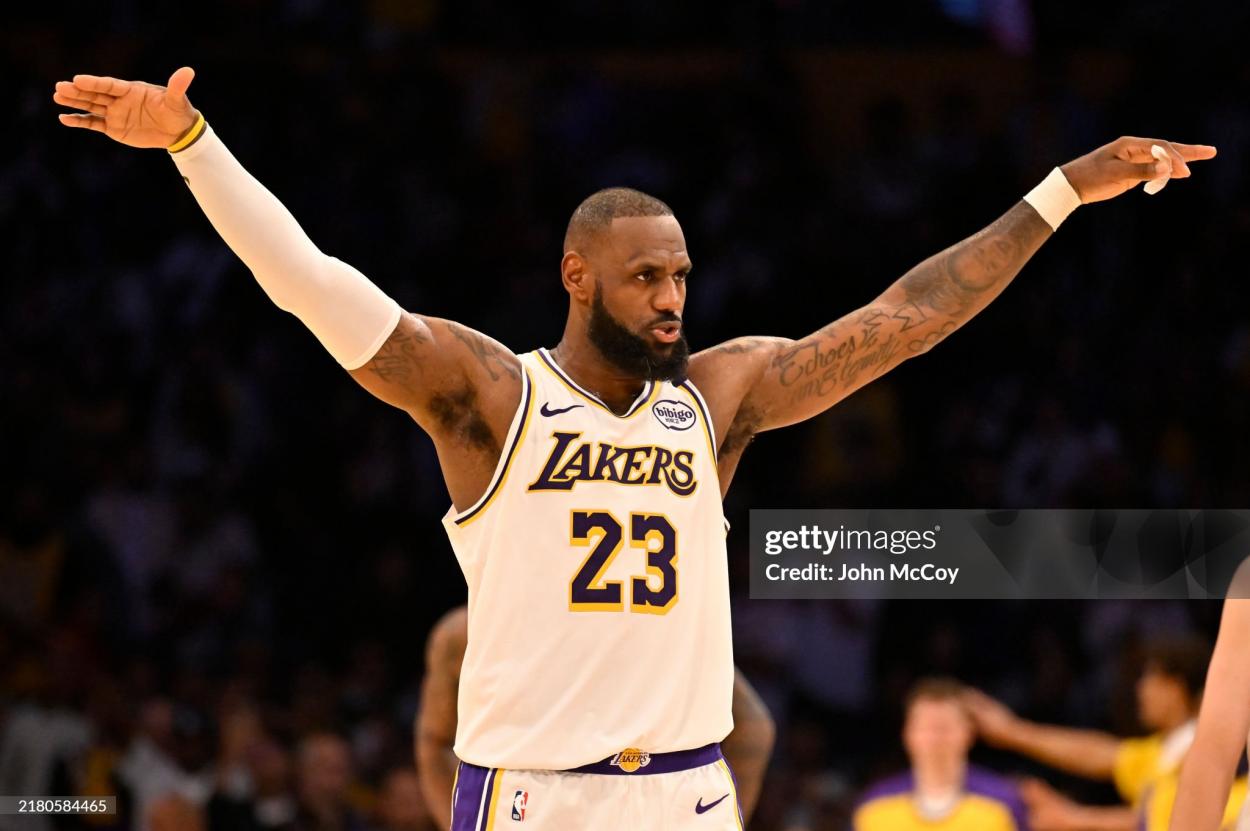 LeBron James #23 of the Los Angeles Lakers asks the crowd to quiet down as Anthony Davis #3 shoots free throws against the Sacramento Kings in the fourth quarter at Crypto.com Arena on October 26, 2024 in Los Angeles, California. NOTE TO USER: User expressly acknowledges and agrees that by downloading and/or using this photo, User agrees to the terms and conditions of the Getty Images License Agreement. (Photo by John McCoy/Getty Images)