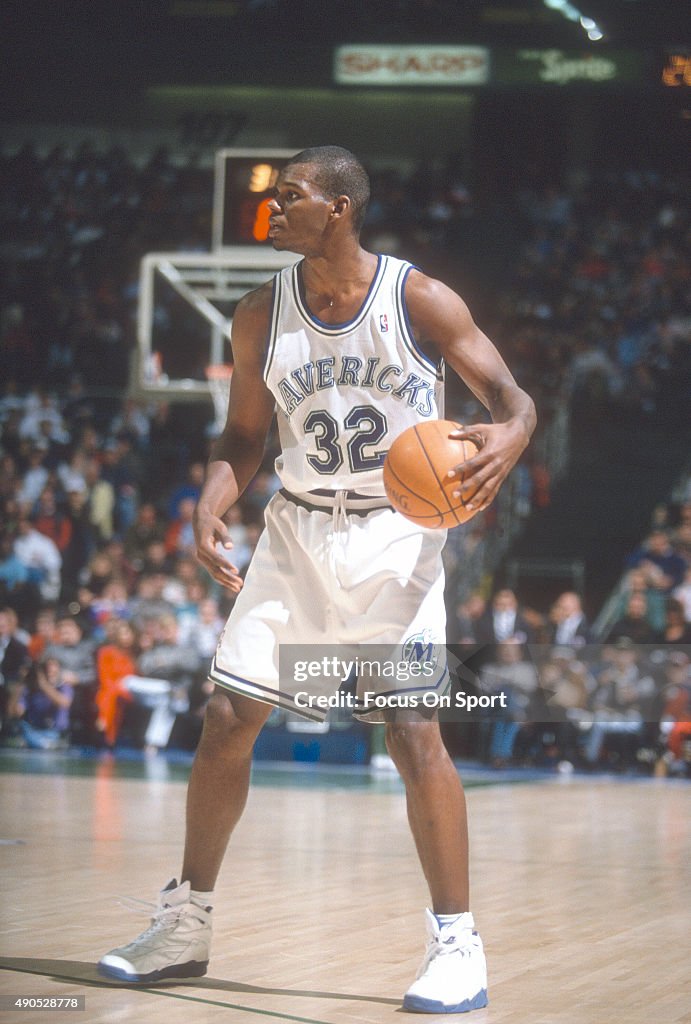 DALLAS, TX - CIRCA 1993: Jamal Mashburn #32 of the Dallas Maverick dribbles the ball against the Chicago Bulls during an NBA basketball game circa 1993 at Reunion Arena in Dallas, Texas. Mashburn played for the Mavericks from 1993-97. (Photo by Focus on Sport/Getty Images)