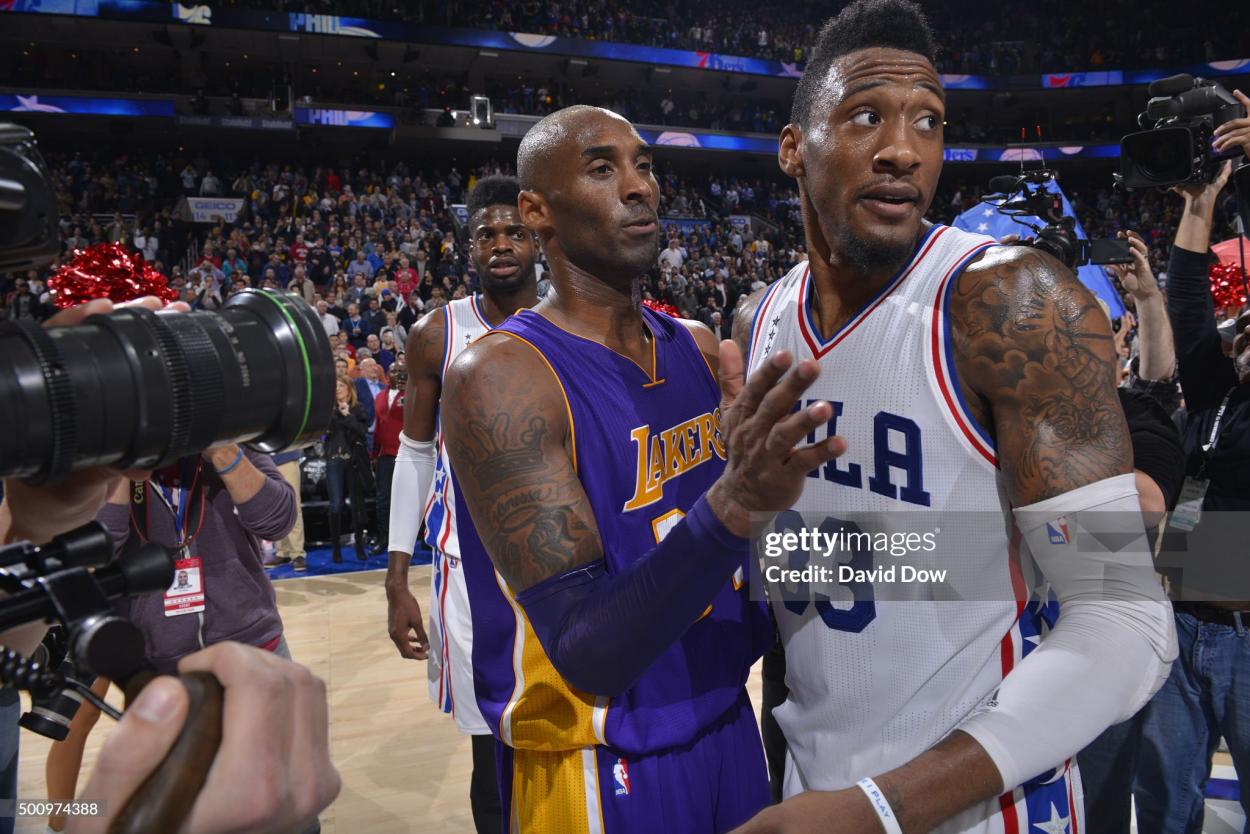 Kobe Bryant embraces Robert Covington following the Sixers' first win in eight months(Photo by David Dow/NBAE via Getty Images)